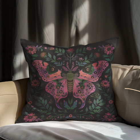 A beautifully detailed pillowcase cover featuring a vibrant moth in shades of pink, purple, and green. The moth is framed by intricate floral designs, including lush green leaves and pink flowers, all set against a dark, moody background. The design evokes a cottagecore aesthetic with gothic undertones, blending nature with a magical, whimsical vibe.